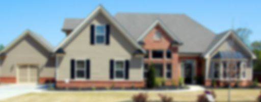 Blurred picture of a large family home.